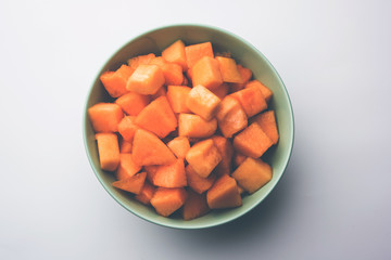 Cantaloupe / muskmelon / kharbuja cut into pieces, served in a bowl. selective focus
