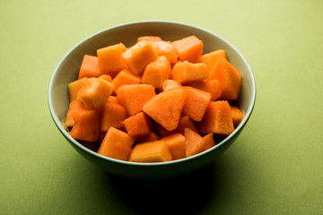 Cantaloupe / muskmelon / kharbuja cut into pieces, served in a bowl. selective focus