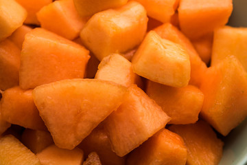 Cantaloupe / muskmelon / kharbuja cut into pieces, served in a bowl. selective focus