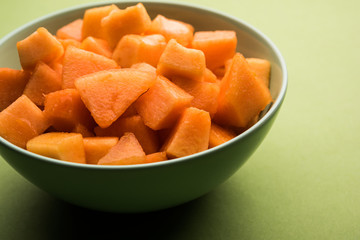 Cantaloupe / muskmelon / kharbuja cut into pieces, served in a bowl. selective focus