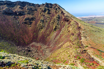 Spain, Lanzarote, Red volcanic soil of giant volcanic crater of volcano corona from crater rim
