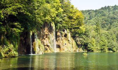 Fototapeta na wymiar Waterfalls and forest, beautiful nature landscape, Plitvice Lakes in Croatia, National Park, sunny day
