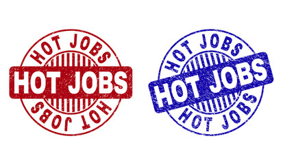 Grunge HOT JOBS round stamp seals isolated on a white background. Round seals with grunge texture in red and blue colors. Vector rubber imprint of HOT JOBS text inside circle form with stripes.