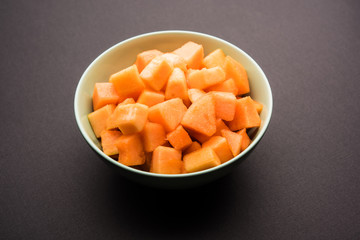 Cantaloupe / muskmelon / kharbuja cut into pieces, served in a bowl. selective focus