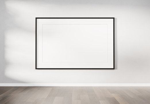 Black frame hanging on a wall mockup 3d rendering