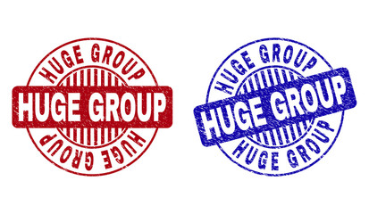 Grunge HUGE GROUP round stamp seals isolated on a white background. Round seals with distress texture in red and blue colors. Vector rubber imprint of HUGE GROUP text inside circle form with stripes.