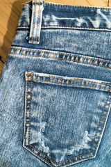 Close up of  blue denim jeans fabric texture background.