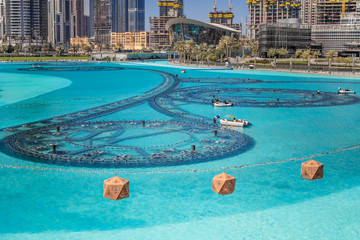 The Dubai fountain lake in the day