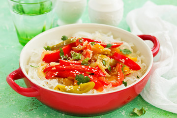 Baked bell peppers with rice noodles in Asian style.
