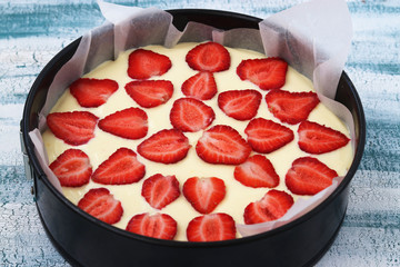 Preparation of curd pie with strawberries for baking,