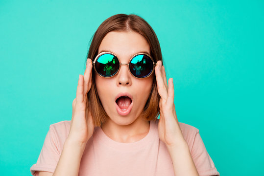 Close up photo beautiful funny funky her she lady hold sunglass oh no expression said wrong bad thing trip abroad danger wear specs casual pastel t-shirt clothes isolated teal turquoise background