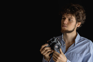 Bearded man taking photo. Photographer with old  fashion camera