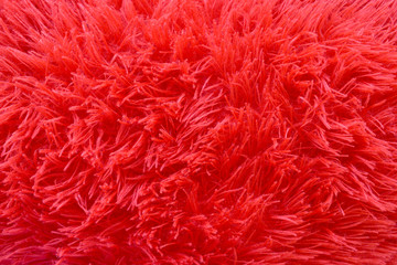 Texture of long red synthetic fibers