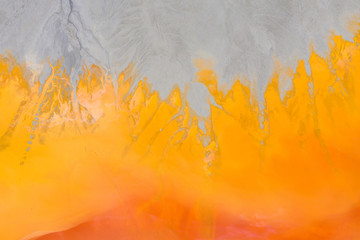 Aerial view of a mining decanting pond with toxic red residuals
