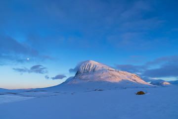 Tent in the snow covered moiuntains of Sarek, in Swedish Lapland. Sweden.