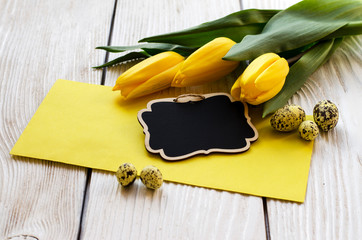 Beautiful Tulips flower on a wooden background. - Image