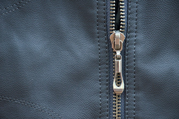 Close-up of zipper on leather texture