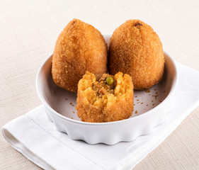 Arancini di Sicilia or fried stuffed rice balls