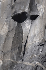 Climbers attempt to climb jagged granite of El Capitan in Yosemite National Park