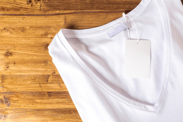 White t-shirt on a wooden background