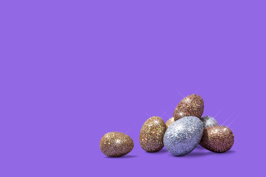 Sparkly Easter Eggs on Bright Purple Background, Conceptual Image with Copy Space