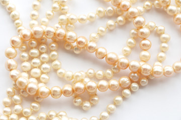 pearl beads on a white background. copy space...