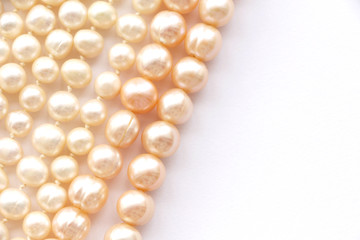 pearl beads on a white background. copy space...