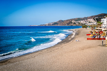The beach of Nerja (Playa el Chucho), tourist resort Malaga region, Costa del Sol, Andalucia, Spain