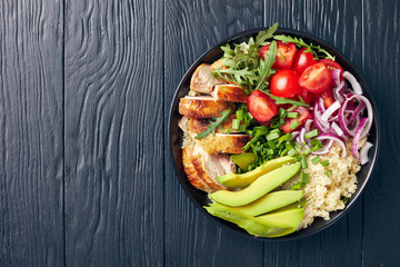 chicken bowl with couscous, greens and veggies