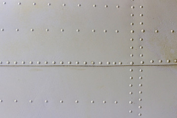 gray metal wall texture with seams and rivets