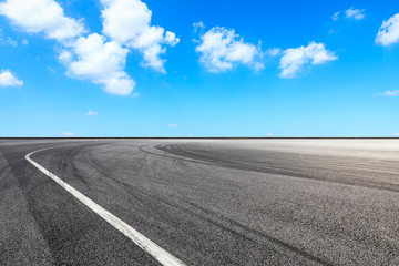Asphalt race track ground and beautiful sky clouds scene