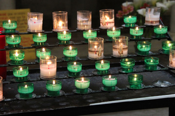Candles in a church in Brittany (France)