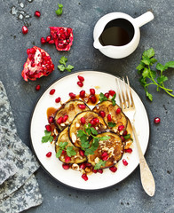 Fried eggplants with pomegranate sauce and nuts.