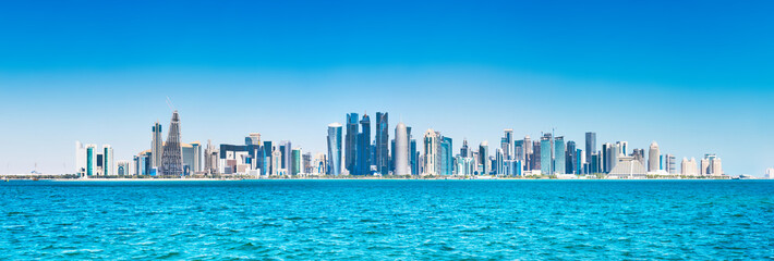 Fototapeta na wymiar Panorama of city of Doha, Qatar downtown with skyscrapers, view from sea bay