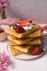 Waffles with strawberries and whipped cream
