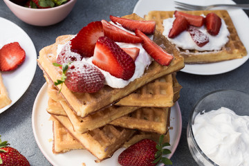 Homemade belgian Waffle. Strawberies and whiped cream.