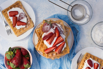 Waffles with strawberries and whipped cream