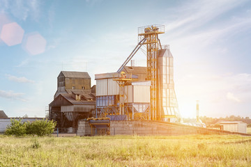 Big group of grain dryers complex for drying wheat. Modern grain silo. © tatsiana502