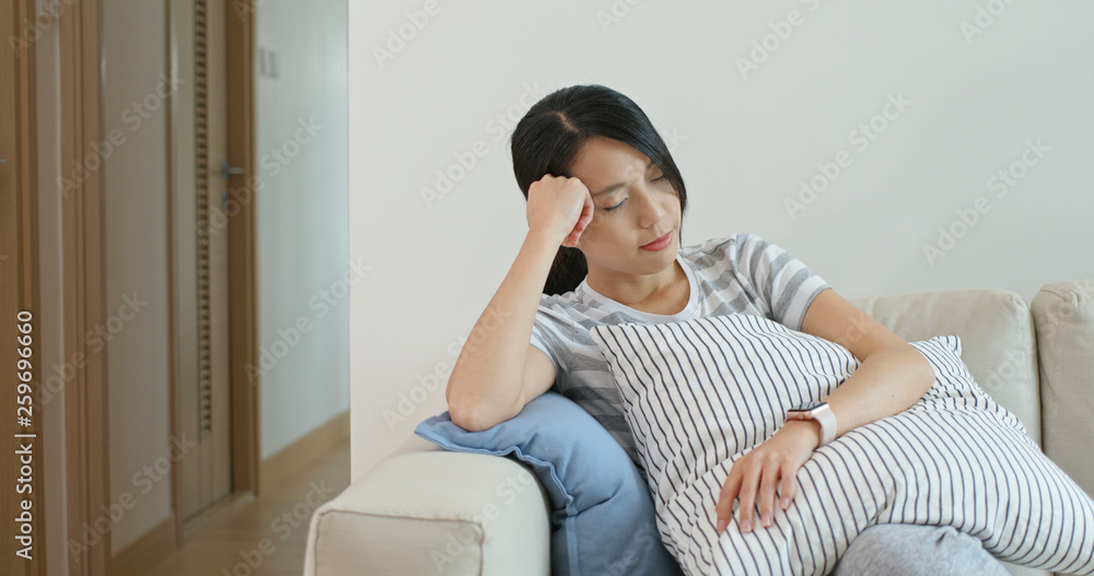 Canvas Prints Woman feel tired and sleep on sofa at home