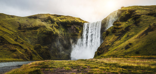 Beautiful scenery of the majestic Skogafoss Waterfall in countryside of Iceland in summer. Skogafoss waterfall is the top famous natural landmark and tourist destination place of Iceland and Europe.