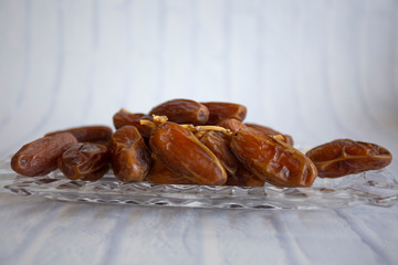 Ifthar Food evening meal for Ramadan kareem,Concept: Date of Islamic fasting,fruit date placed on a white background rosary