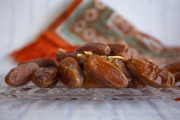 Ifthar Food evening meal for Ramadan kareem,Concept: Date of Islamic fasting,fruit date placed on a white background rosary