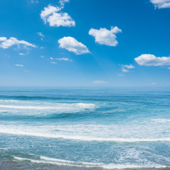Fototapeta na wymiar Blue ocean waves. Breaking waves at sunny day. Tropical resort