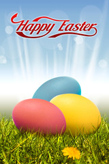 Three Easter eggs on the grass with the rays of the sun and beautiful inscription