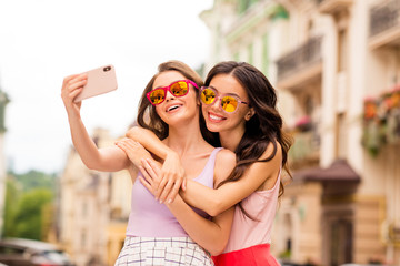 Portrait beautiful trendy cheerful bloggers people best students hairstyle travel stroll photos blog internet trip long hair bright eyewear eyeglasses spectacles cuddle  pastel clothing town center 