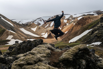 Traveler hiking at Landmannalaugar surreal nature landscape in highland of Iceland, Nordic, Europe....