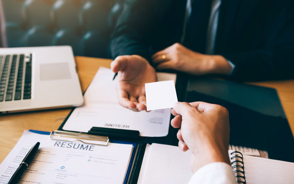 Employees submit business cards to job interviewers and interested in joining him contact immediately.