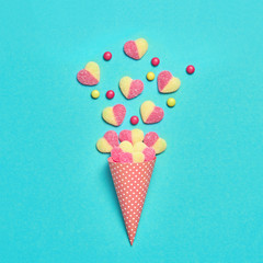 Ice Cream cone with Candy Sweets gummy desert. Fashion Flat lay. Party, birthday firework. Pastel vanilla Color. Trendy creative art Style. Minimal, sweet. Love Valentine Day concept