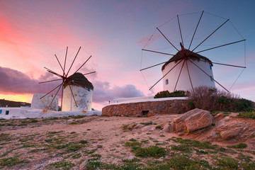 Old traditional windmills over the town of Mykonos.