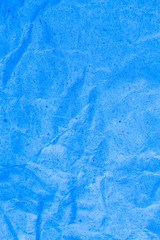 Blue vignette crumpled paper.